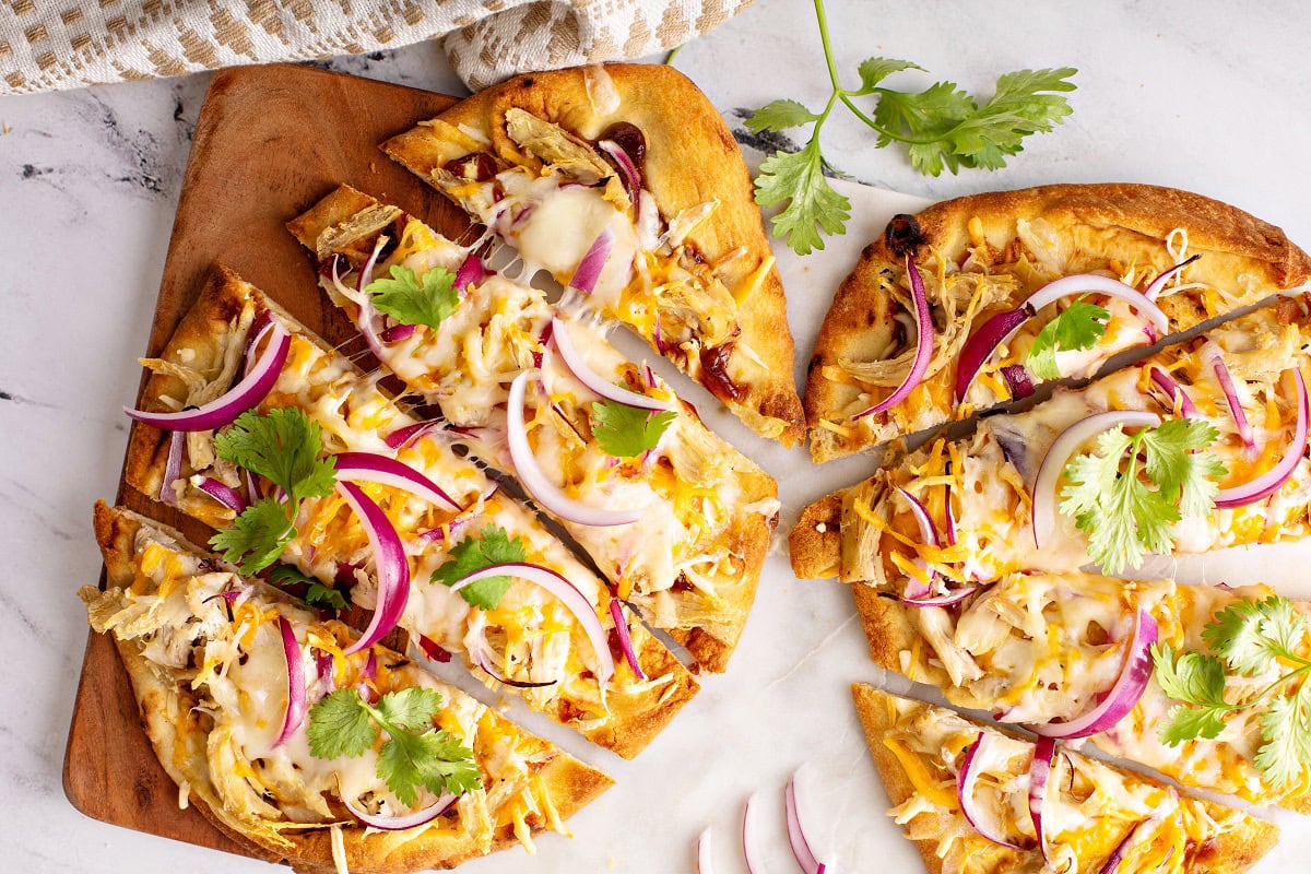 13 Dinner Recipes That Make Leftovers Taste Better Than Day One barbecue chicken flatbreads with hot sauce and red 2025 03 13 07 38 57 utc
