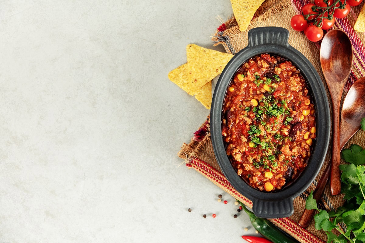 13 Dinner Recipes That Make Leftovers Taste Better Than Day One mexican chili con carne with corn chips peppers 2025 07 09 09 19 23 utc