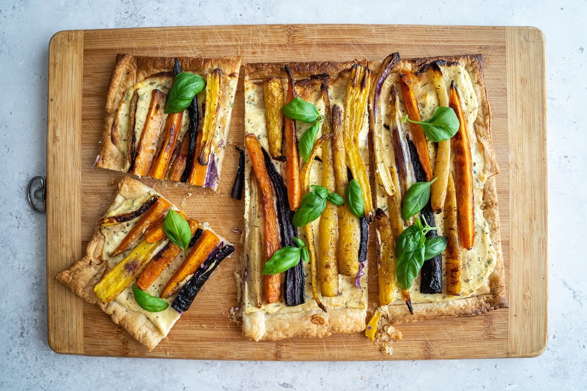 12 Dinner Recipes That Look Fancy But Take 20 Minutes or Less top down view of a colorful rainbow carrot pie wit 2024 12 07 05 24 27 utc